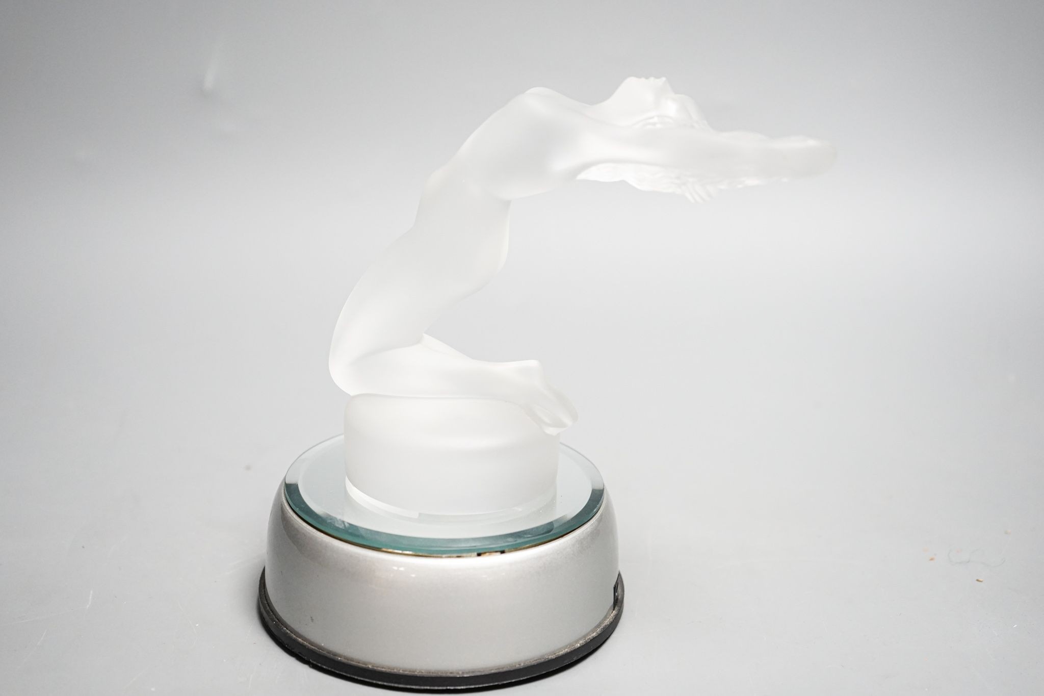 A post war Lalique Chrysis clear frosted glass paperweight or car mascot, with light up base. 13cm excl base